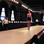 Models walking down the runway during rehearsal.
